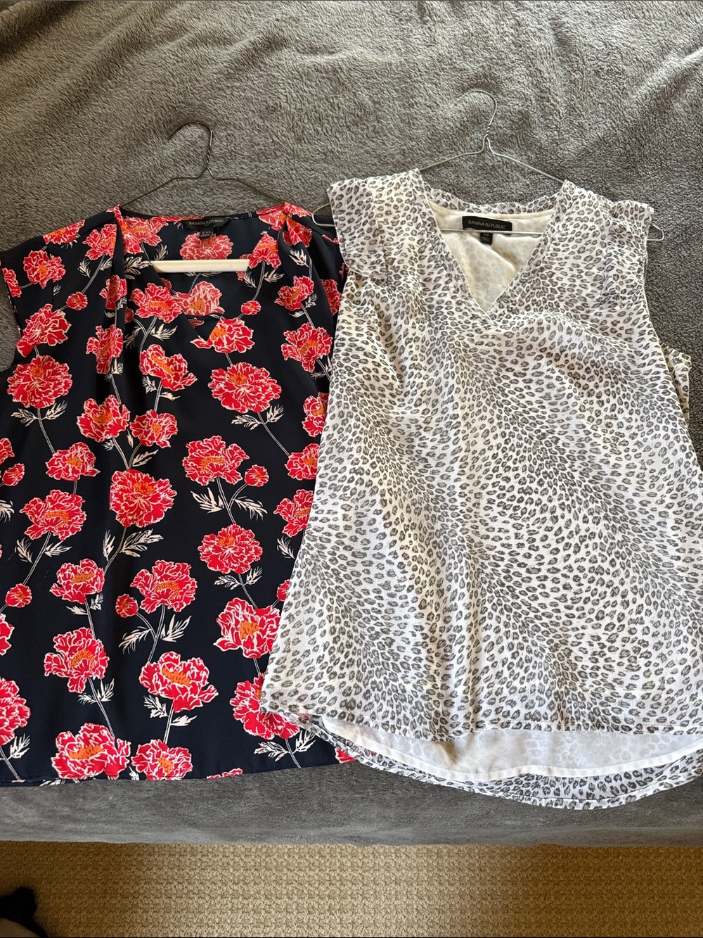 Two Banana Republic sleeveless blouses.